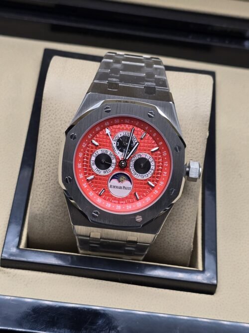 Audemars Piguet — esfera roja con subesferas y brazalete plateado
