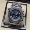 Audemars Piguet — esfera negra deportiva con subesferas y brazalete plateado
