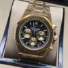 Audemars Piguet — esfera negra con subesferas doradas