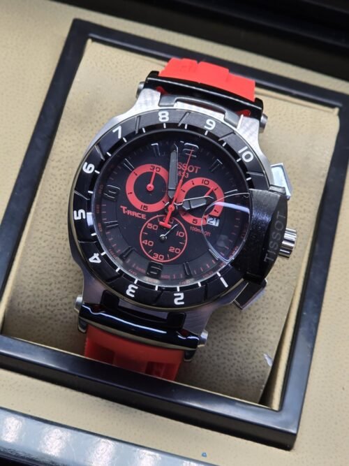Tissot — esfera negra con detalles rojos y correa roja