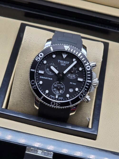 Tissot — esfera negra con subesferas y correa negra texturizada