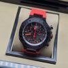 Tissot — esfera negra con detalles rojos y bisel oscuro