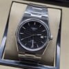 Tissot — esfera negra texturizada y brazalete plateado