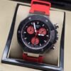 Tissot — esfera negra con subesferas rojas y correa roja