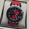 Tissot — esfera negra con subesferas rojas y correa roja texturizada