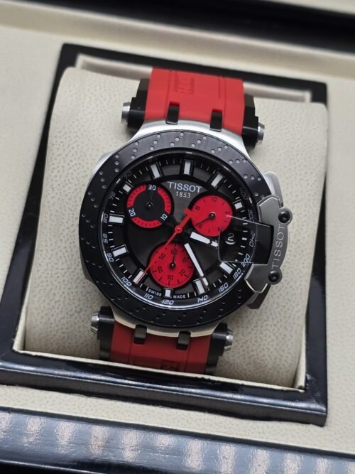 Tissot — esfera negra con subesferas rojas y correa roja texturizada