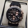 Tissot — esfera negra con subesferas rosadas y correa negra