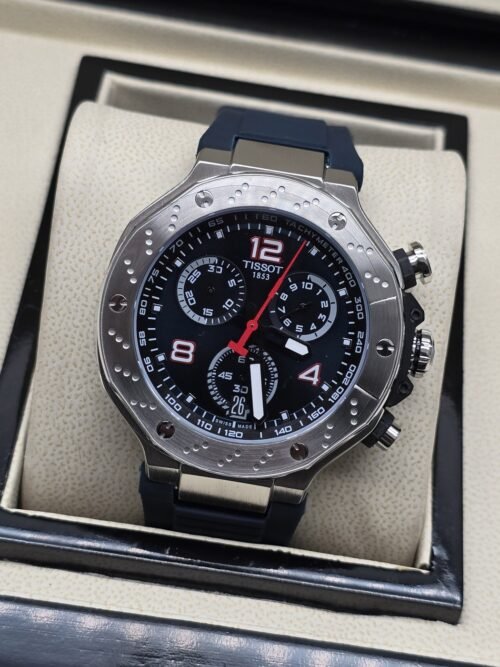 Tissot — esfera negra con detalles rojos y caja plateada