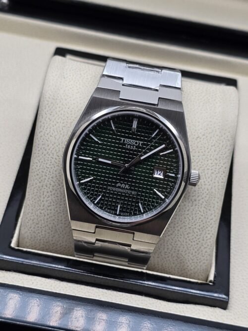 Tissot — esfera verde texturizada y brazalete plateado