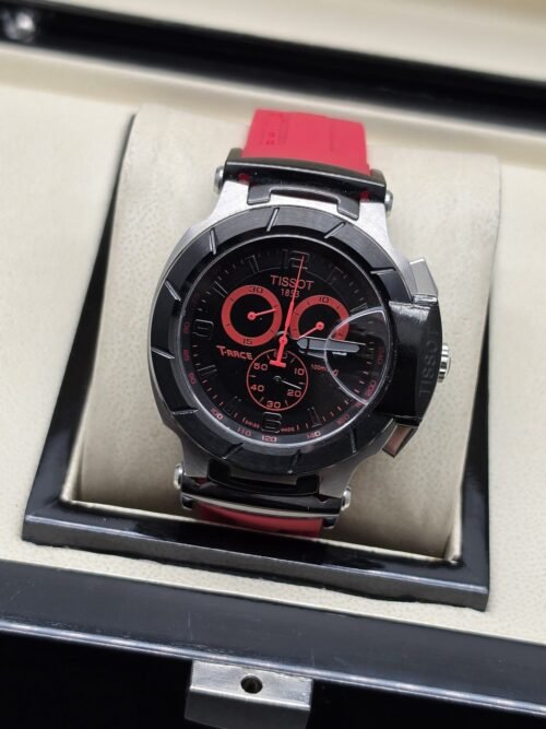 Tissot — esfera negra con detalles rojos y correa roja