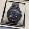 Tissot — esfera negra con detalles amarillos y brazalete oscuro
