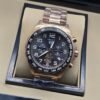 TAG Heuer — esfera gris con números blancos y brazalete rosado