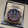TAG Heuer — esfera negra con aro rojo y brazalete rosado