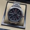 TAG Heuer — esfera negra con subesferas y brazalete plateado