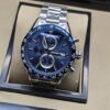 TAG Heuer — esfera azul con dos subesferas y brazalete plateado