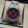 TAG Heuer — esfera roja con subesferas y brazalete plateado