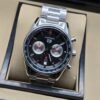 TAG Heuer — esfera negra con subesferas plateadas y brazalete plateado
