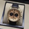 TAG Heuer — esfera dorada con subesferas negras y correa negra