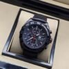 TAG Heuer — esfera negra con detalles rojos y caja negra