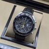 TAG Heuer — esfera negra con detalles amarillos y correa negra