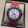 TAG Heuer — esfera blanca con subesferas y correa roja