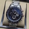 TAG Heuer — esfera azul con tres subesferas y brazalete plateado