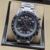 TAG Heuer — esfera negra con números blancos y brazalete plateado