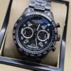 TAG Heuer — esfera abierta negra y brazalete plateado