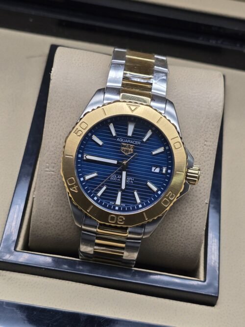 TAG Heuer — esfera azul con bisel dorado y brazalete bicolor