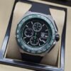 TAG Heuer — esfera negra con bisel verde y correa negra