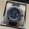 TAG Heuer — esfera negra con detalles azules y correa negra