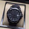 TAG Heuer — esfera negra texturizada y caja negra