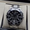 TAG Heuer — esfera negra con subesferas y bisel negro