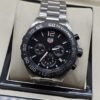 TAG Heuer — esfera negra con subesferas y bisel graduado