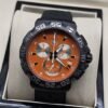 TAG Heuer — esfera naranja con subesferas claras y correa negra