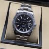 Rolex — esfera negra con subesfera y brazalete plateado