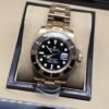 Rolex — esfera y bisel negros con brazalete bicolor