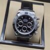 Rolex — esfera negra con subesferas claras y correa negra