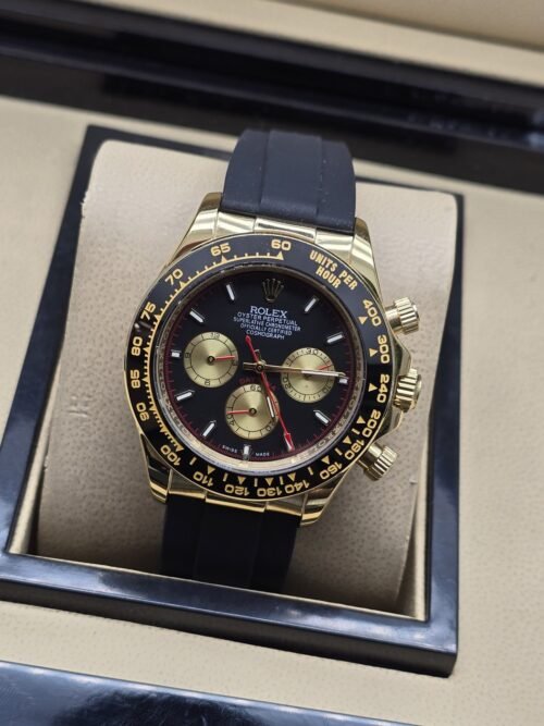 Rolex — esfera negra con subesferas doradas y correa negra