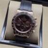 Rolex — esfera marrón oscura con subesferas y correa negra