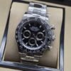 Rolex — esfera negra con subesferas y brazalete plateado