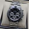 Rolex — esfera negra con subesferas claras y brazalete plateado