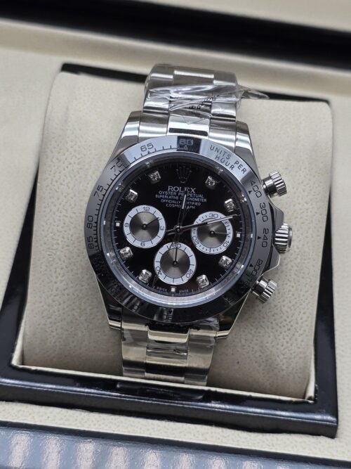 Rolex — esfera negra con subesferas claras y brazalete plateado