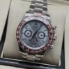 Rolex — esfera gris con subesferas y bisel rojizo