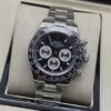 Rolex — esfera negra con subesferas claras y brazalete plateado