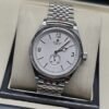 Rolex — esfera blanca con subesfera inferior y brazalete plateado