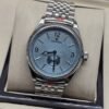 Rolex — esfera azul con subesfera inferior y brazalete plateado