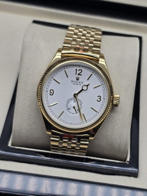 Rolex — esfera blanca con subesfera inferior y brazalete dorado
