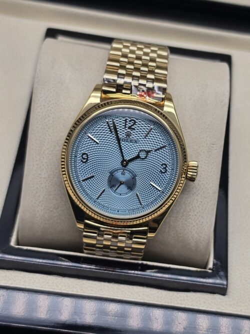 Rolex — esfera azul con subesfera inferior y brazalete dorado
