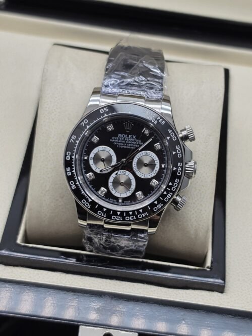 Rolex — esfera negra con subesferas claras y brazalete plateado